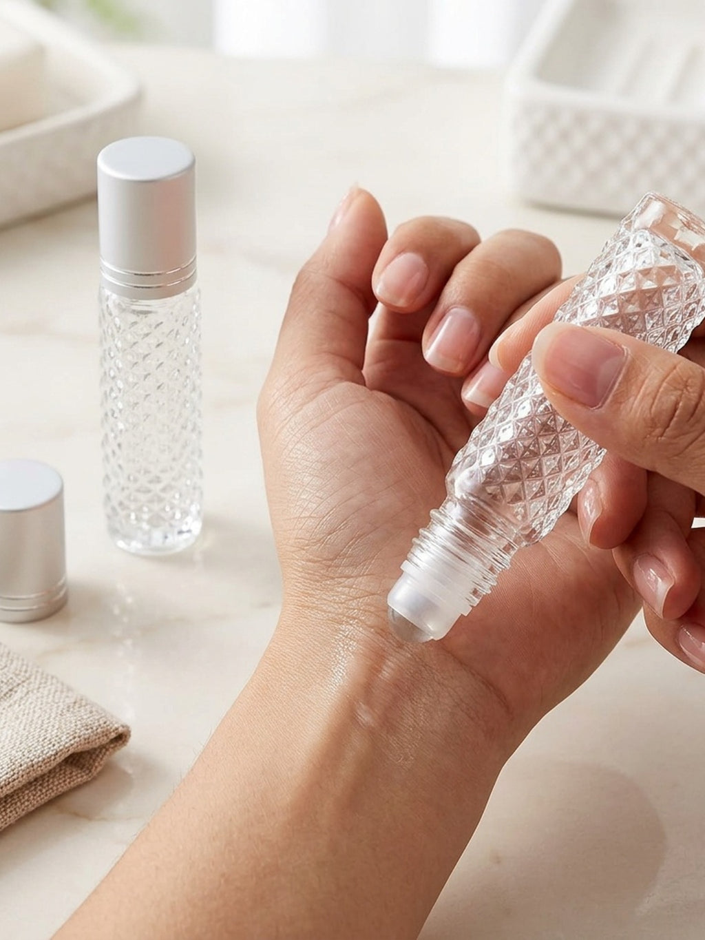 two refillable glass ball bottles designed cosmetics